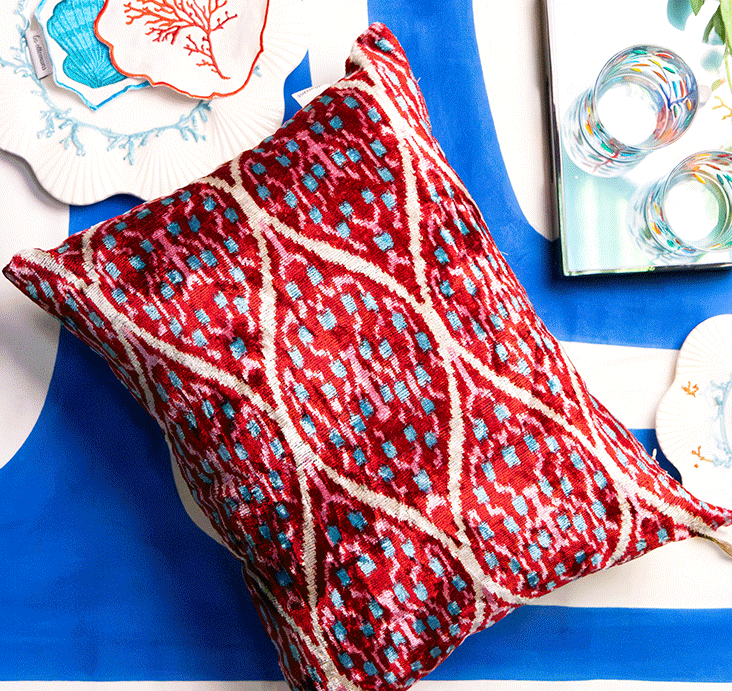 Three Les-Ottomans cushions in red, multicolour and indigo ikat patterns